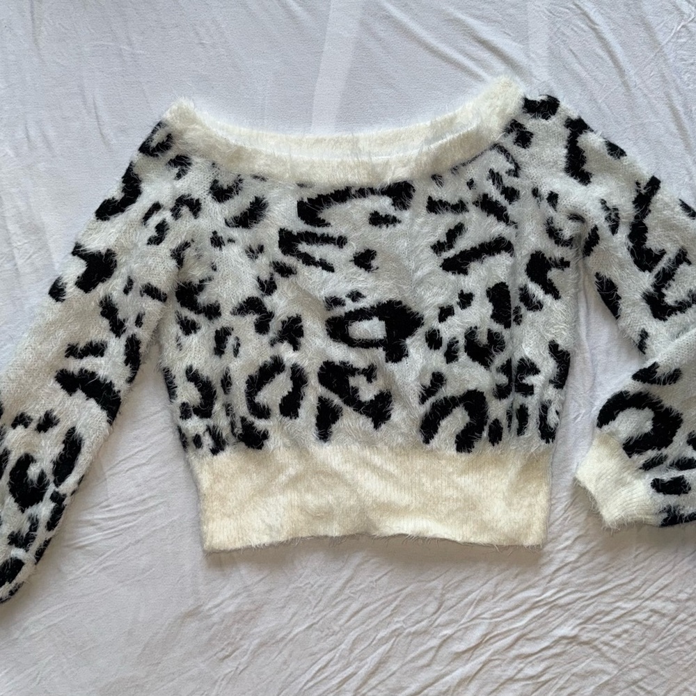Fuzzy white and black cheetah off-shoulder sweater